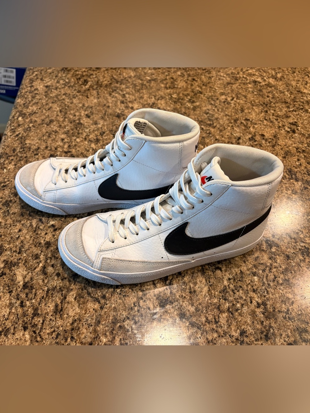 Nike Women’s White High-Top Sneakers with Black Swoosh